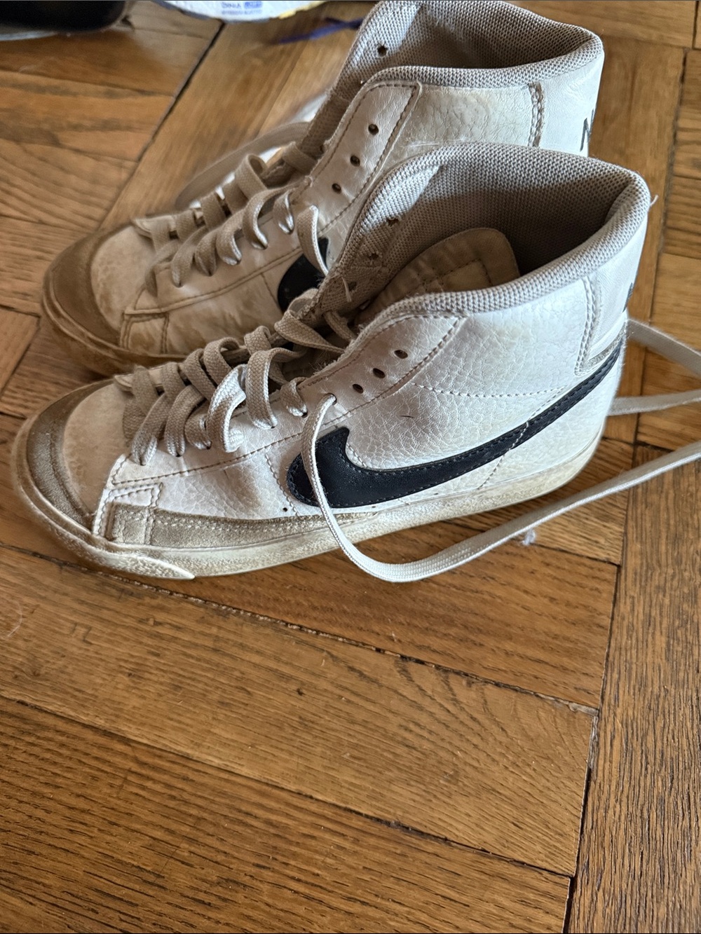 Nike Beige High-Top Sneakers with Black Swoosh